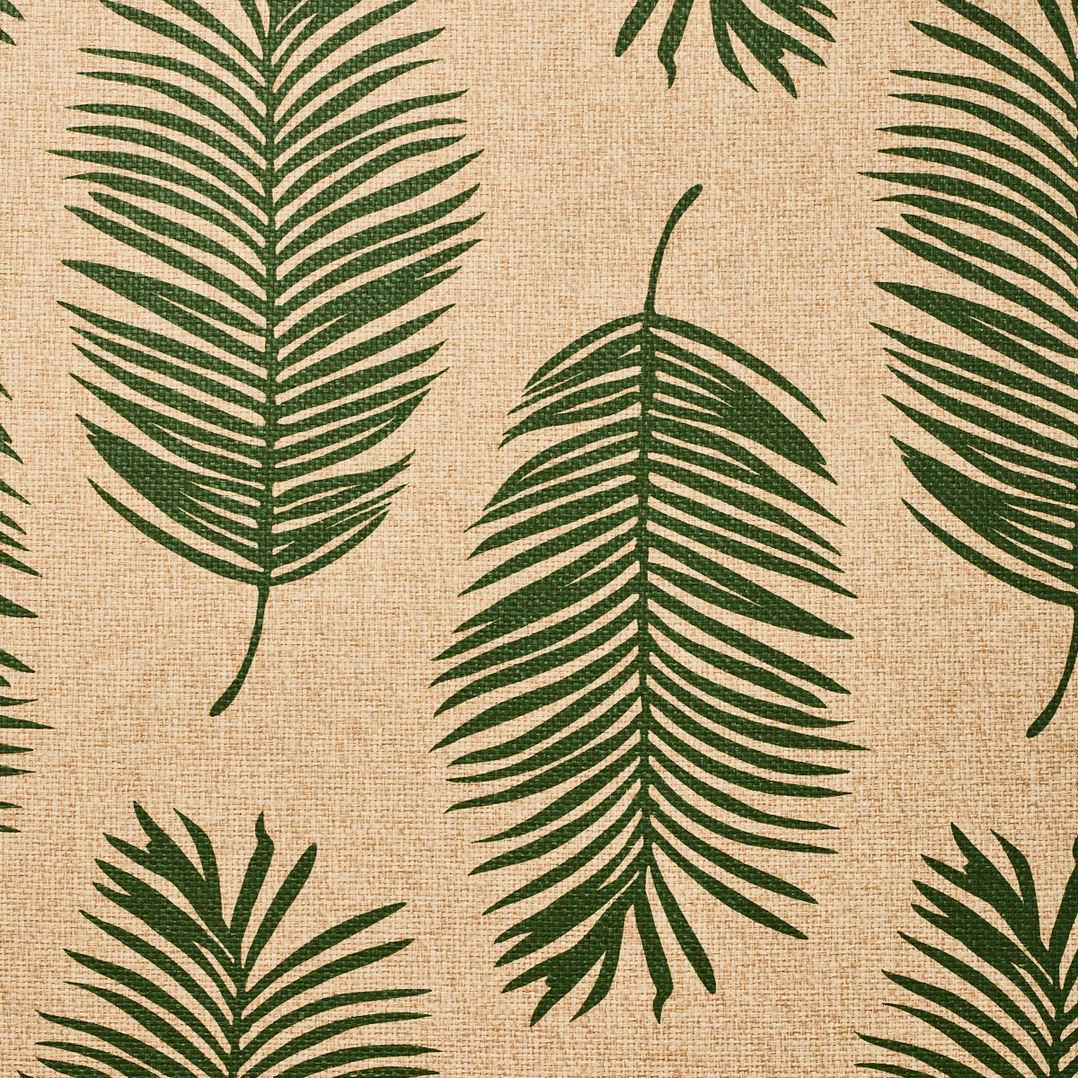 Detail of fabric in a large-scale leaf print in dark green on a tan field.