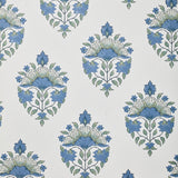 Detail of wallpaper in a floral paisley print in shades of blue and green on a greige field.