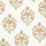 Detail of wallpaper in a floral paisley print in shades of green and coral on a white field.