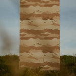 Fabric panel with mountain and horse pattern on grass and sky background