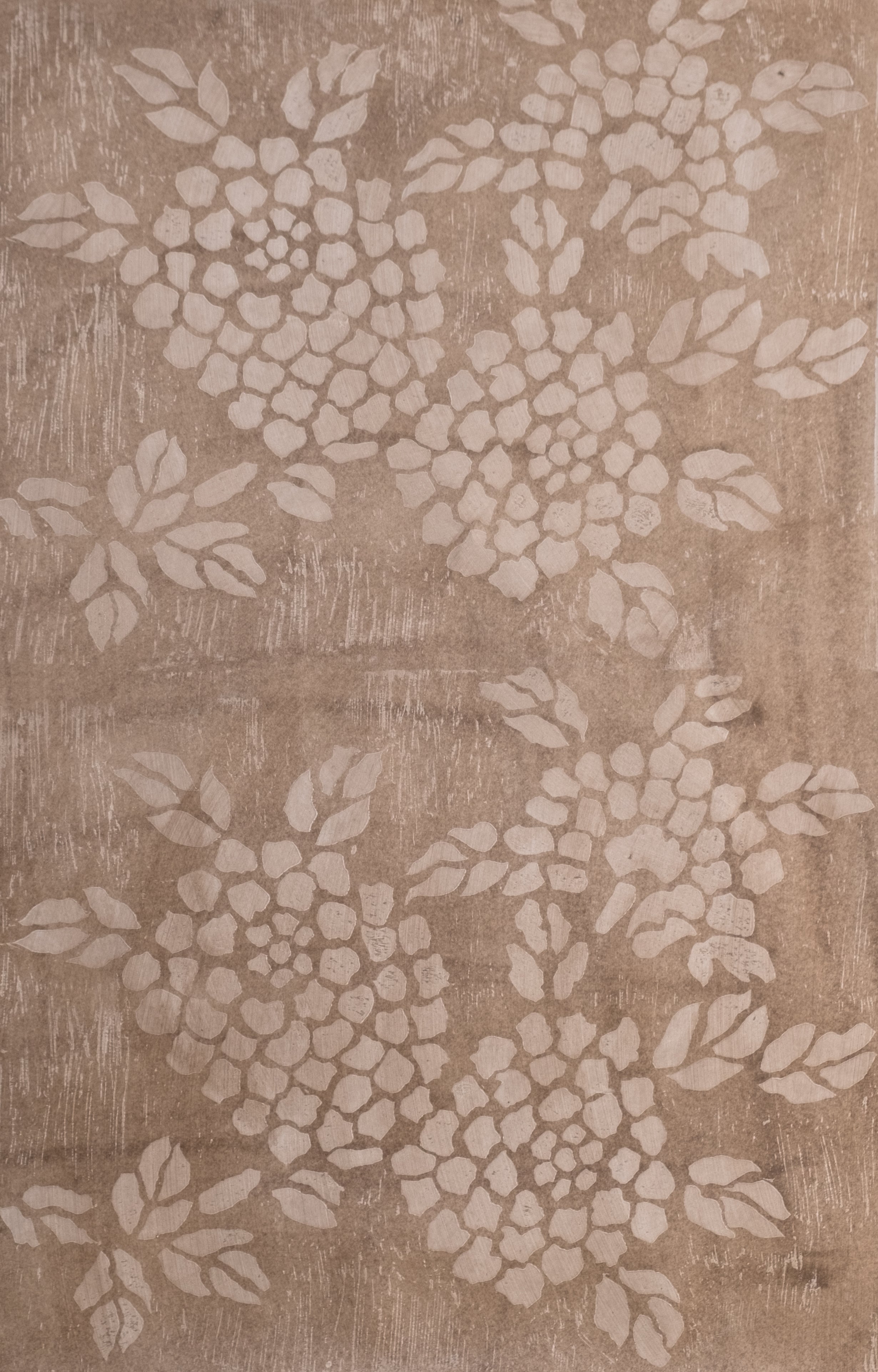 Detail of wallpaper in a minimalist floral print in cream on a mottled tan field.