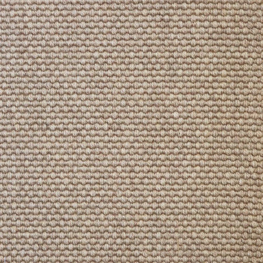 Broadloom carpet swatch in a solid pattern light tan color