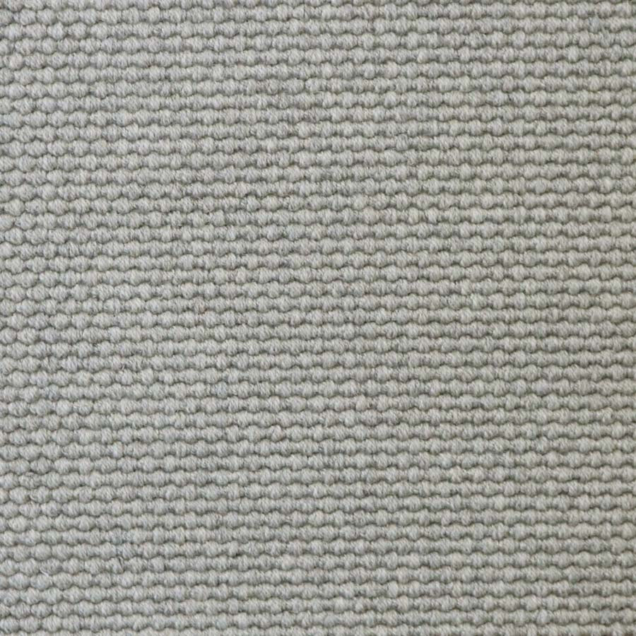 Broadloom carpet swatch in a solid pattern light grey color