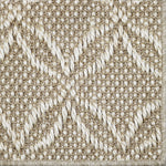 Close-up of a broadloom carpet in a lattice design in beige and white 