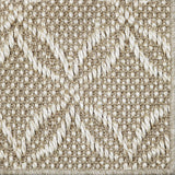 Close-up of a broadloom carpet in a lattice design in beige and white 