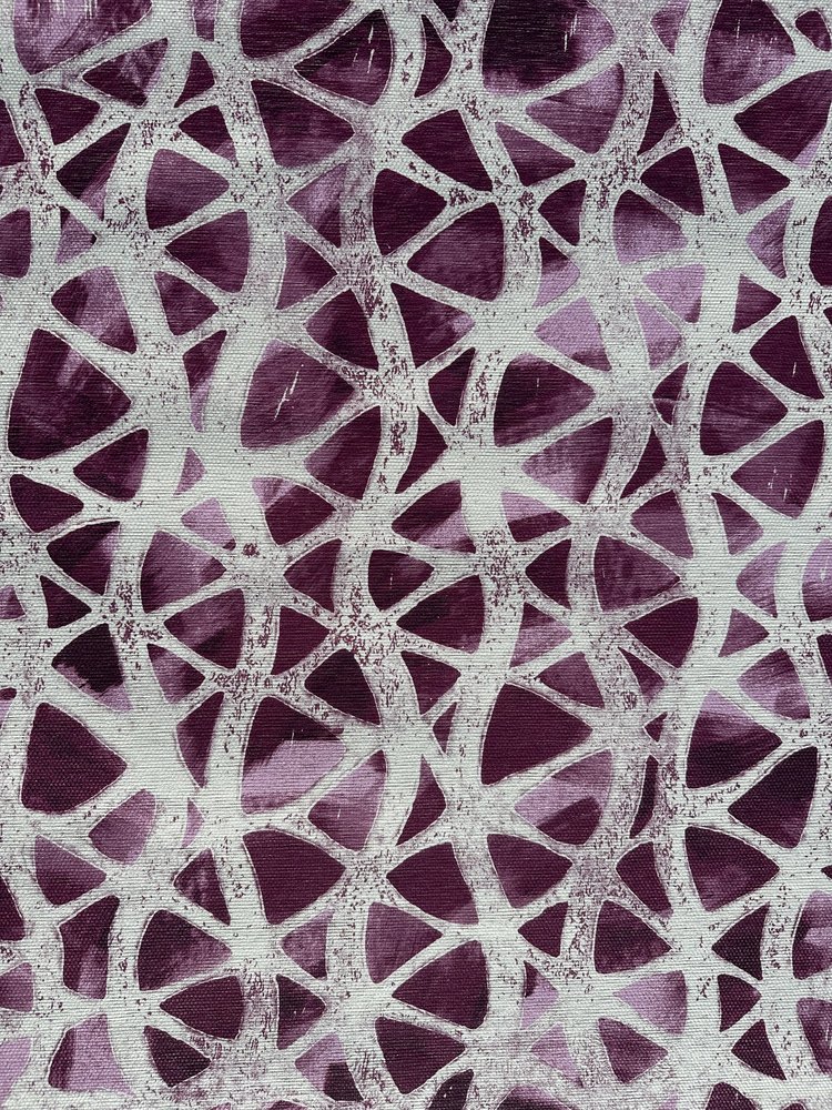 Detail of fabric in an abstract grid print in gray on a mottled purple field.