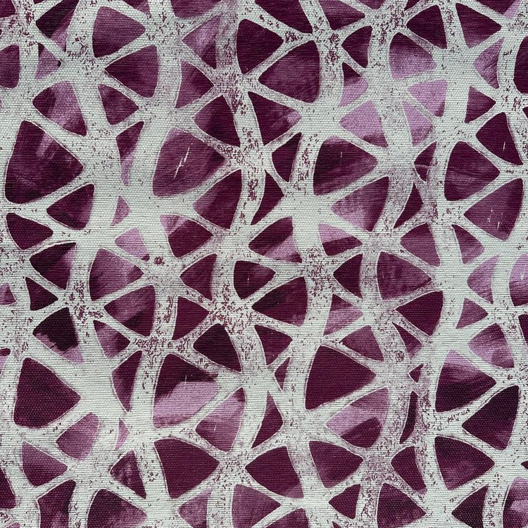 Detail of fabric in an abstract grid print in gray on a mottled purple field.