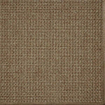 Close-up of a textured woven performance carpet in brown.