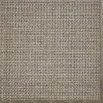 Close-up of a textured woven performance carpet in taupe.