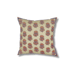 Square throw pillow with a repeating thistle pattern in delicate Indian kantha embroidery on a gold field.