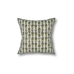 Square throw pillow with a striped floral pattern in delicate Indian kantha embroidery on a cream field.