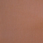 Detail of velvet fabric yardage in apricot.