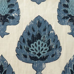 Detail of fabric in a botanical damask print in shades of blue and black on a cream field.