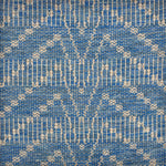 Handwoven rug sample in a bold chevron pattern in marine blue with white striping. 