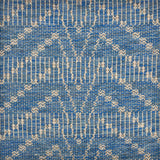 Handwoven rug sample in a bold chevron pattern in marine blue with white striping. 