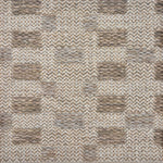 Handwoven rug sample in an irregular  checker pattern in shades of cream, oatmeal and taupe. 