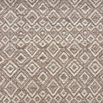 Handwoven rug sample in a radiating diamond pattern in shades of taupe and cream. 