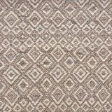 Handwoven rug sample in a radiating diamond pattern in shades of taupe and cream. 