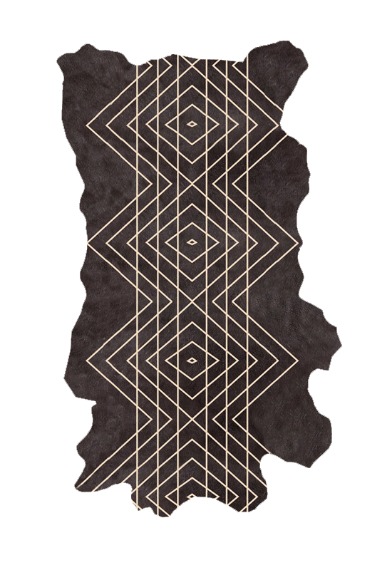 Detail of a cowhide rug in black with a tan geometric overlay.