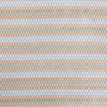 Detail of a woven upholstery leather in a striped coral, tan and white colorway.