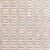 Detail of woven upholstery leather in a grid pattern in metallic tan.