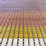 Close-up of a leather rug in a woven stripe pattern in shades of purple, black, coral and yellow.