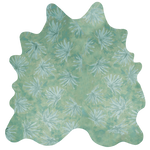 Detail of a cowhide rug in green with a painterly flower print in shades of blue.