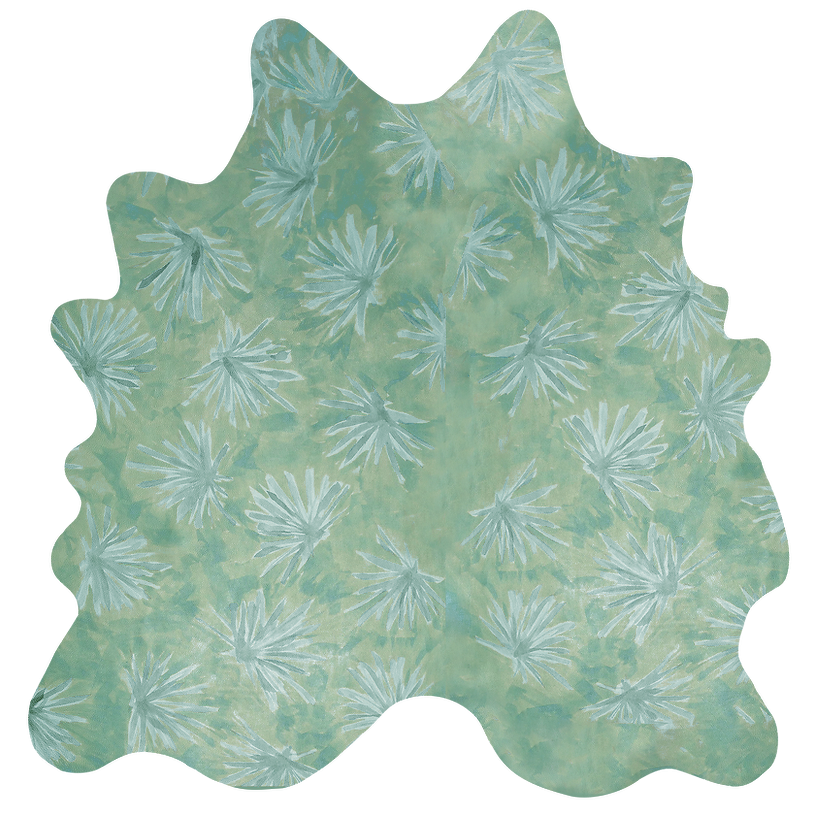 Detail of a cowhide rug in green with a painterly flower print in shades of blue.