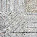 Close-up of a textured rug with geometric pattern