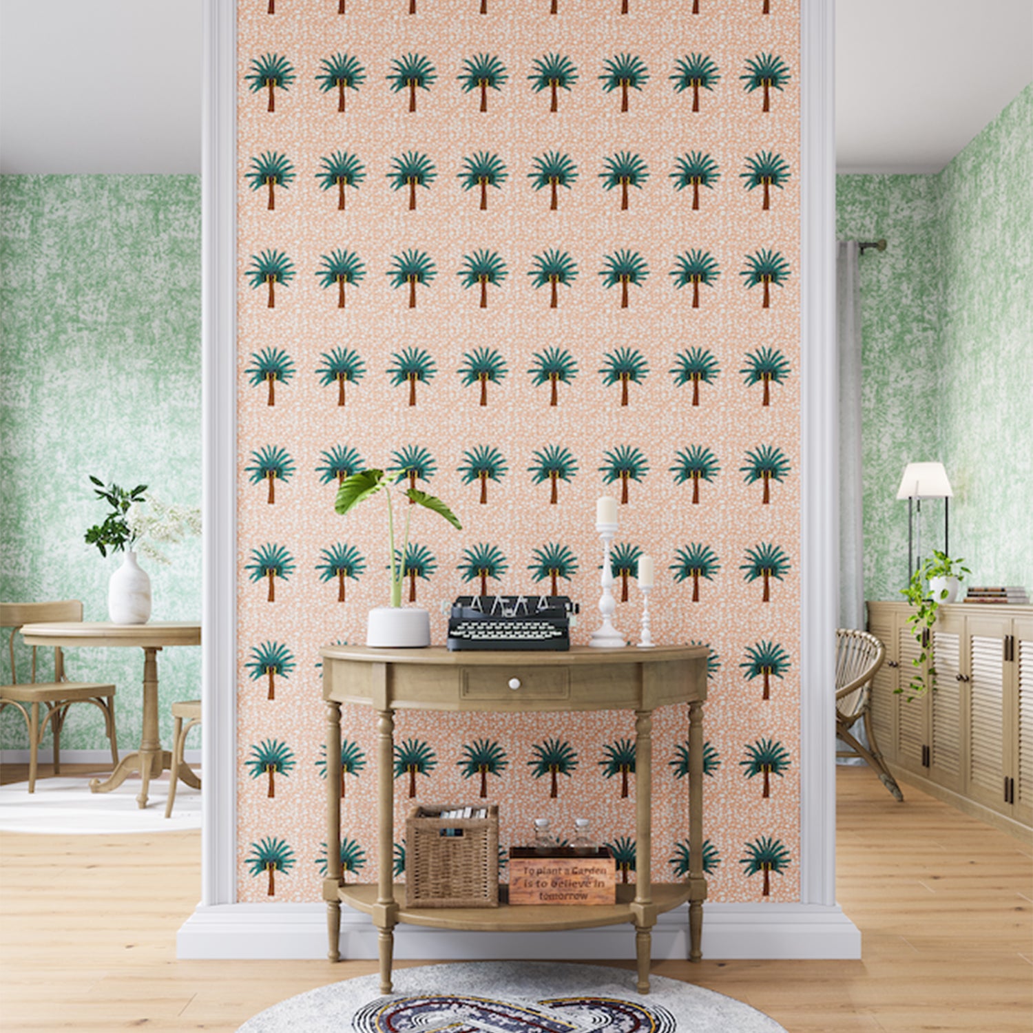 A maximalist living space with an accent wall papered in a repeating palm tree print in turquoise, brown, pink and white.