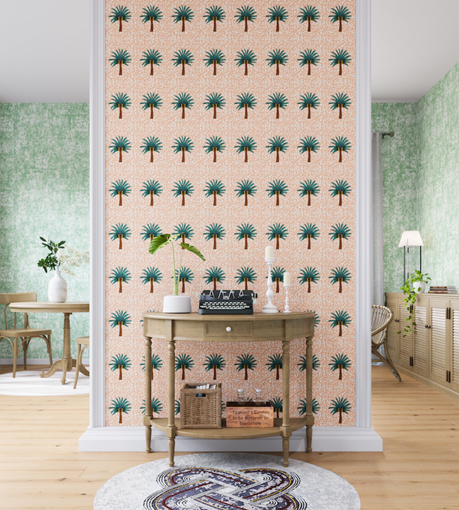 A maximalist living space with an accent wall papered in a repeating palm tree print in turquoise, brown, pink and white.