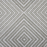 Broadloom carpet sample in a linear diamond design in white and green-grey.