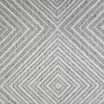 Broadloom carpet sample in a linear diamond design in white and grey.