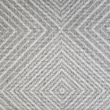 Broadloom carpet sample in a linear diamond design in white and grey.