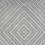 Broadloom carpet sample in a linear diamond design in white and heathered grey