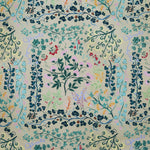 Detail of fabric in a dense floral print in shades of pink, yellow, green and black on a tan field.