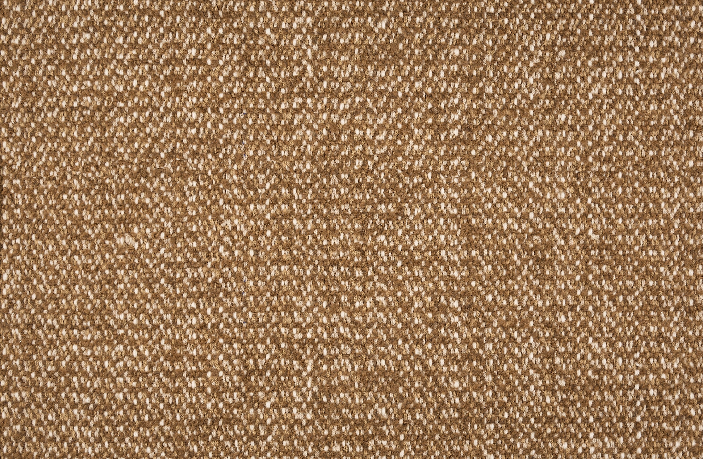 Broadloom carpet in a textural weave in shades of brown with cream accents.