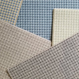 Collection of plaid broadloom swatches in various colors