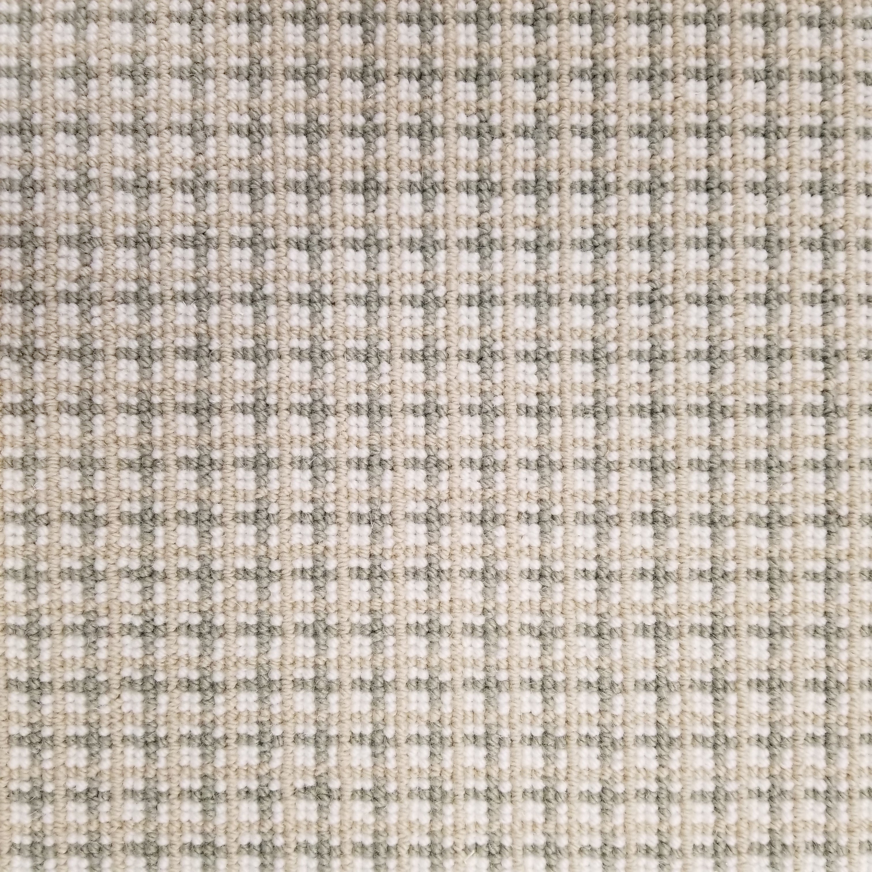 Broadloom carpet with plaid design in beige, cream and ecru.