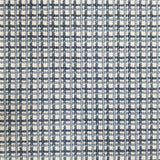 Broadloom carpet with plaid design in blue and ivory.