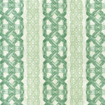 Detail of fabric in a geometric stripe print in shades of green on a mottled field.