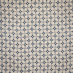 Block printed fabric in a dotted lattice in indigo on natural linen.