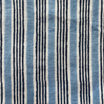 Handprinted stripe in indigo and blue on ivory.
