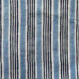 Handprinted stripe in indigo and blue on ivory.