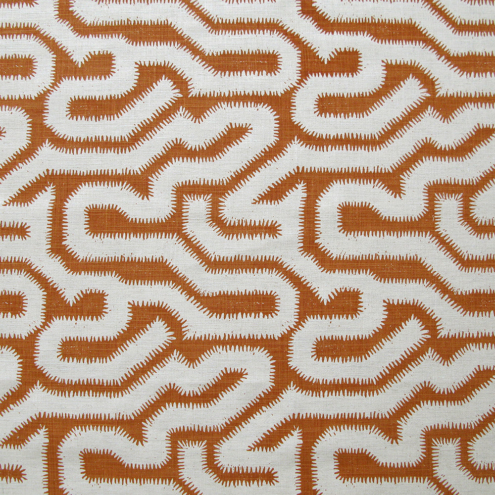 Detail of fabric in a playful meandering print in white on a copper field.