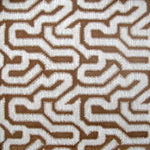 Detail of wallpaper in a playful meandering print in white on a brown field.