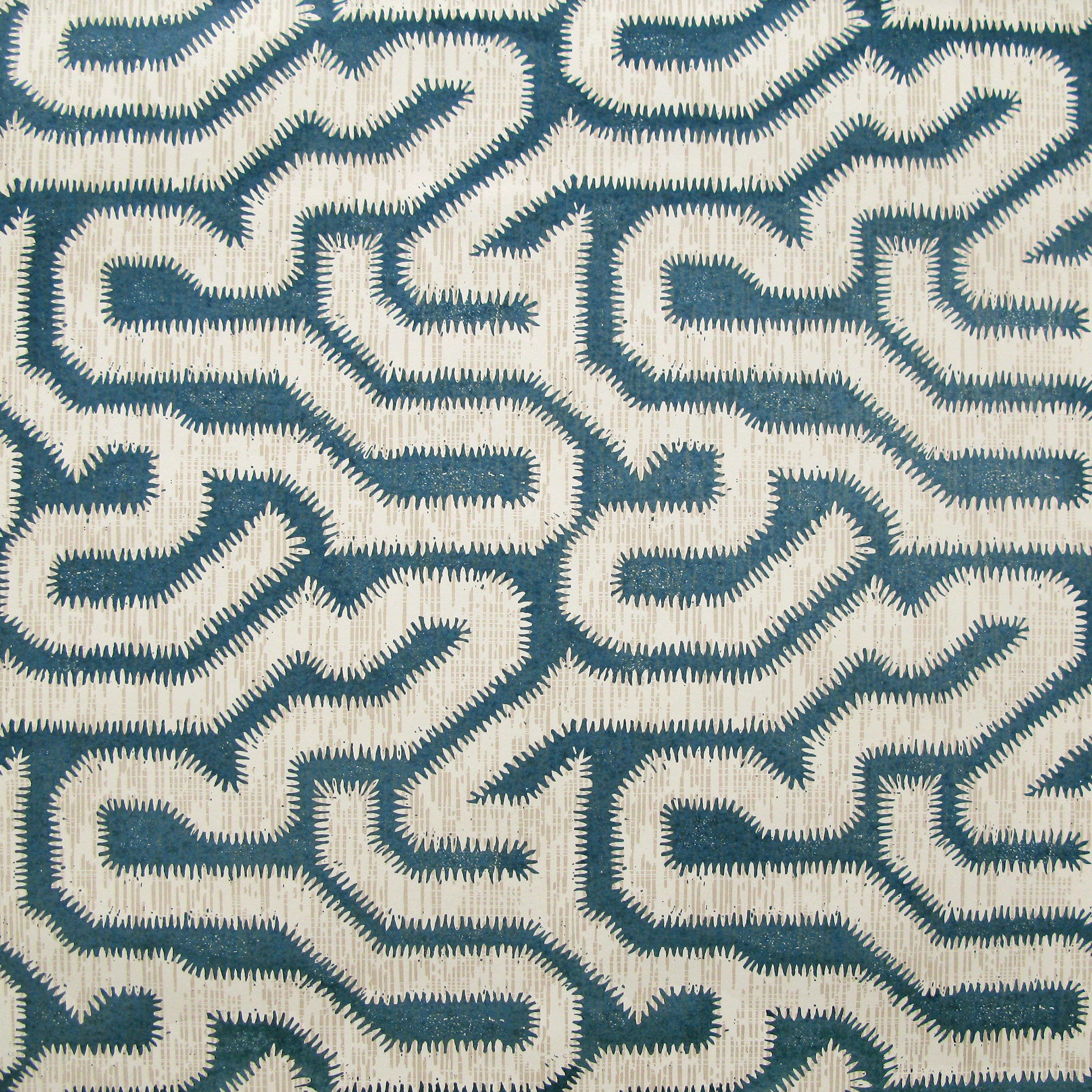 Detail of wallpaper in a playful meandering print in cream on a navy field.