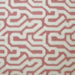 Detail of fabric in a playful meandering print in cream on a dusty rose field.