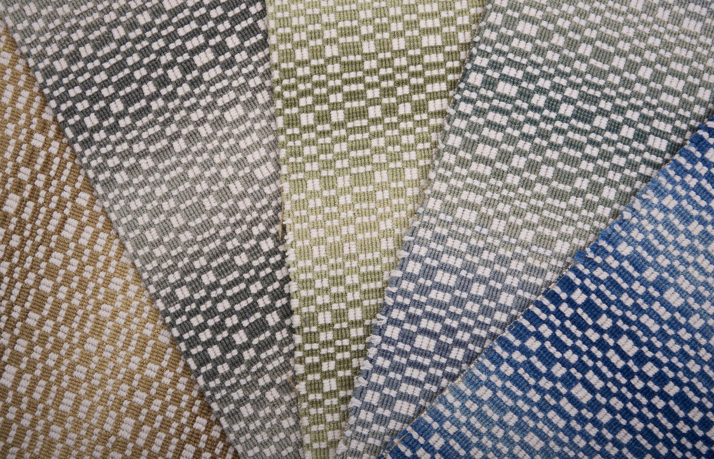 Close-up of broadloom watches in various patterns and colors