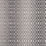 Broadloom carpet with a white checkerboard pattern with an ombré effect in shades of grey. 